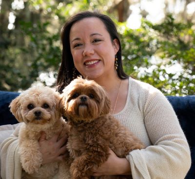 Kim Bucklaw holding dogs